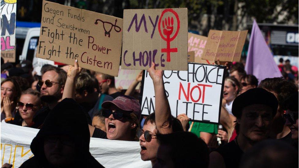 Pro-abortion protesters wave placards in Cologne last September