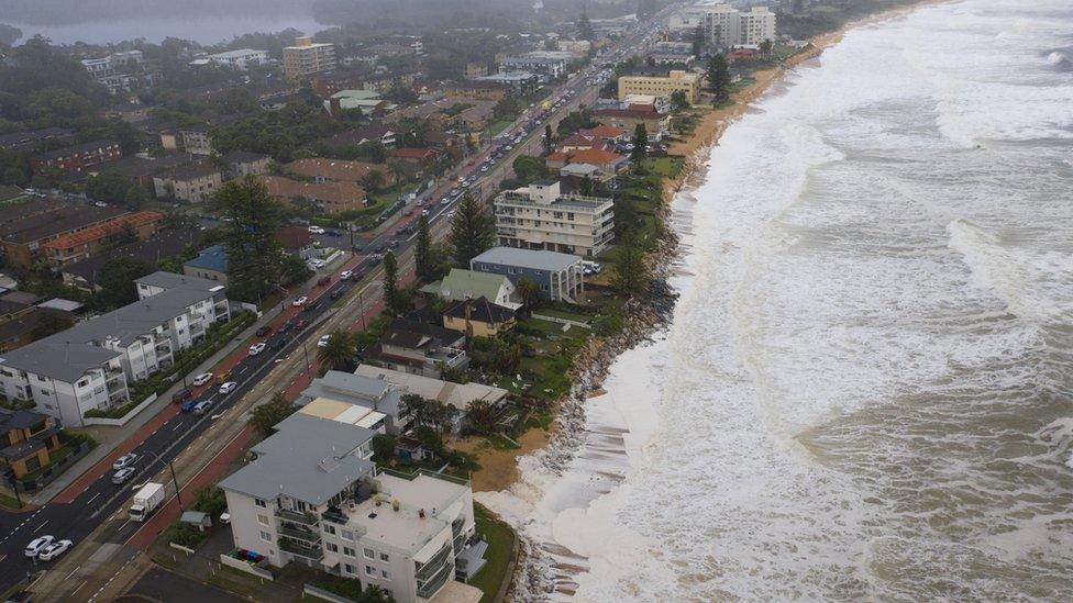 Rough surf laps at beachside homes in Collaroy in Sydney's north