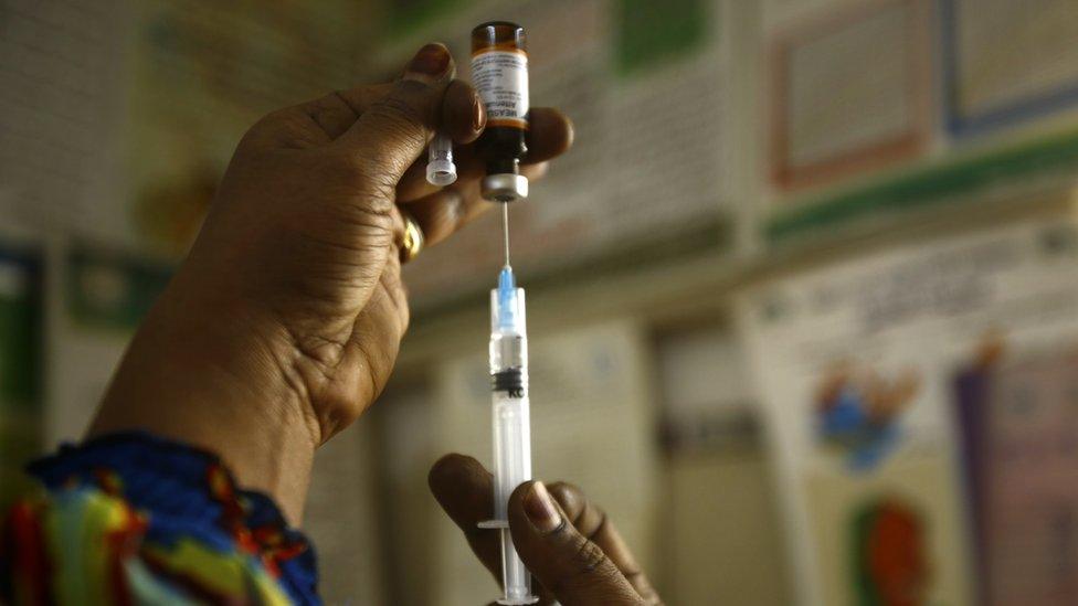 A Sudanese nurse prepares an inoculation against measles at the Samir Medical Clinic in the Sahafa neighbourhood of the Sudanese capital, Khartoum (not south Sudan) on June 22, 2015.