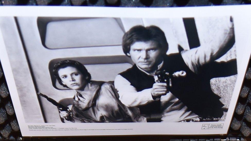 Han Solo brandishing the blaster