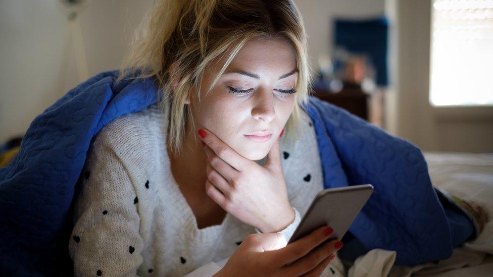 Woman looking at her phone