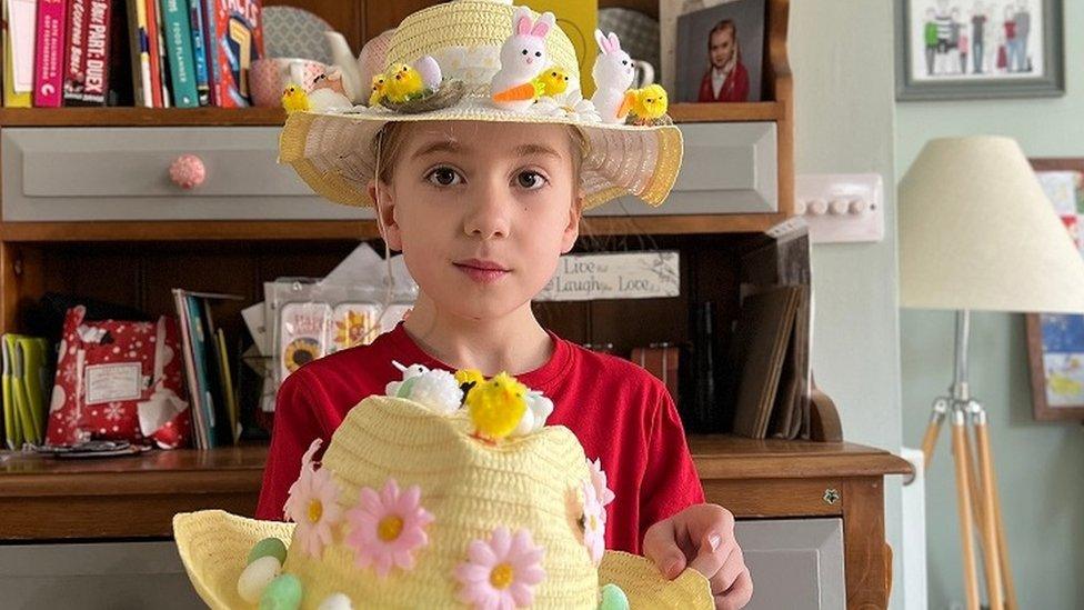 Girl with two bonnets.