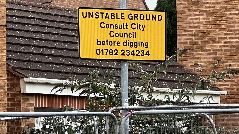 A sign reading ' Unstable ground, consult city council before digging'