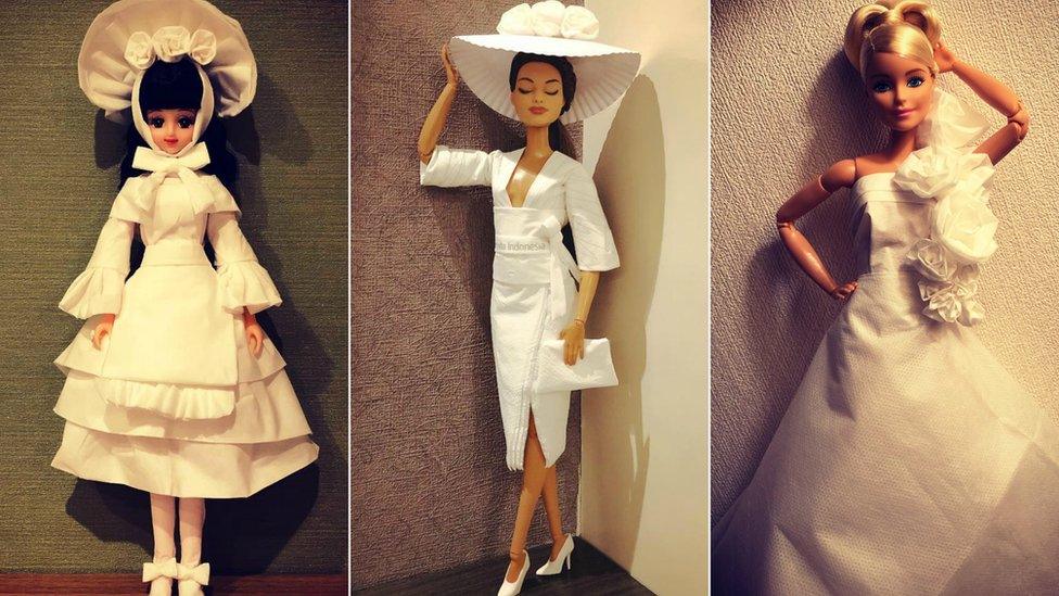 Three dolls dressed in white tissue