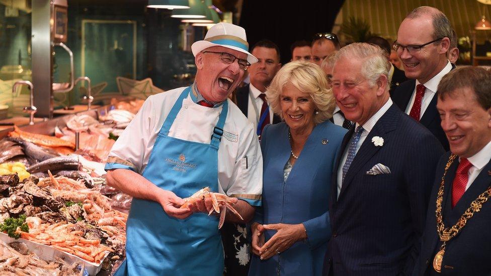 Prince Charles, Prince of Wales and Camilla, Duchess of Cornwall meet fishmonger Pat O'Connell as they visit the English Market in Cork