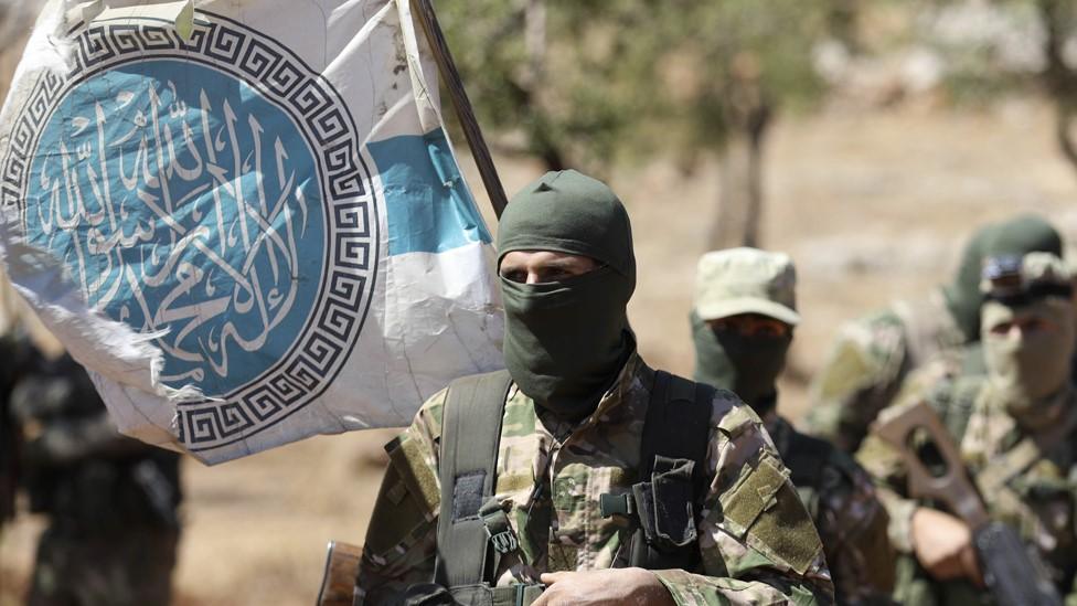 File photo showing Hayat Tahrir al-Sham fighters at a training camp in northern Idlib province on 14 August 2018