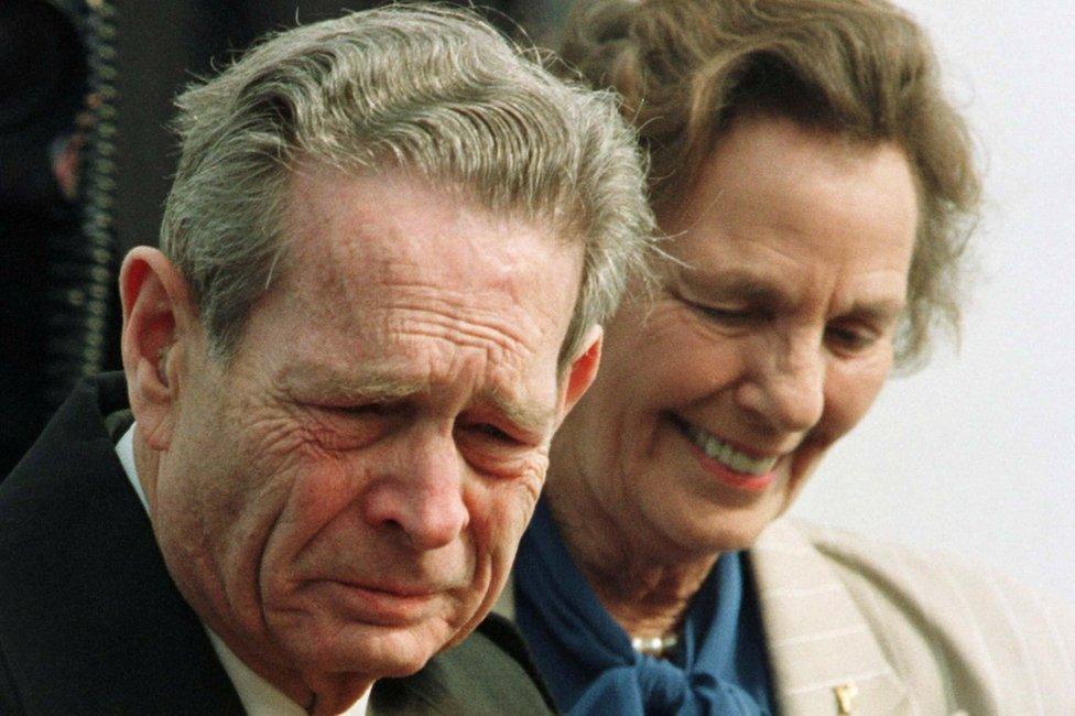 Romania's exiled King Michael, 75, tears streaming down his face, arrives together with his wife Anne in his homeland February 28, 1997