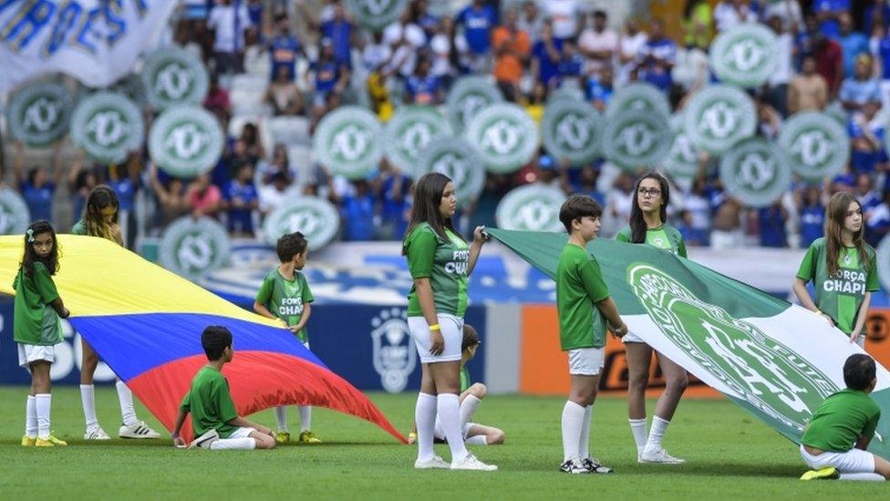 Colombian and Chapecoense flags held on the pitch before Cruzeiro v Corinthians match in Belo Horizonte