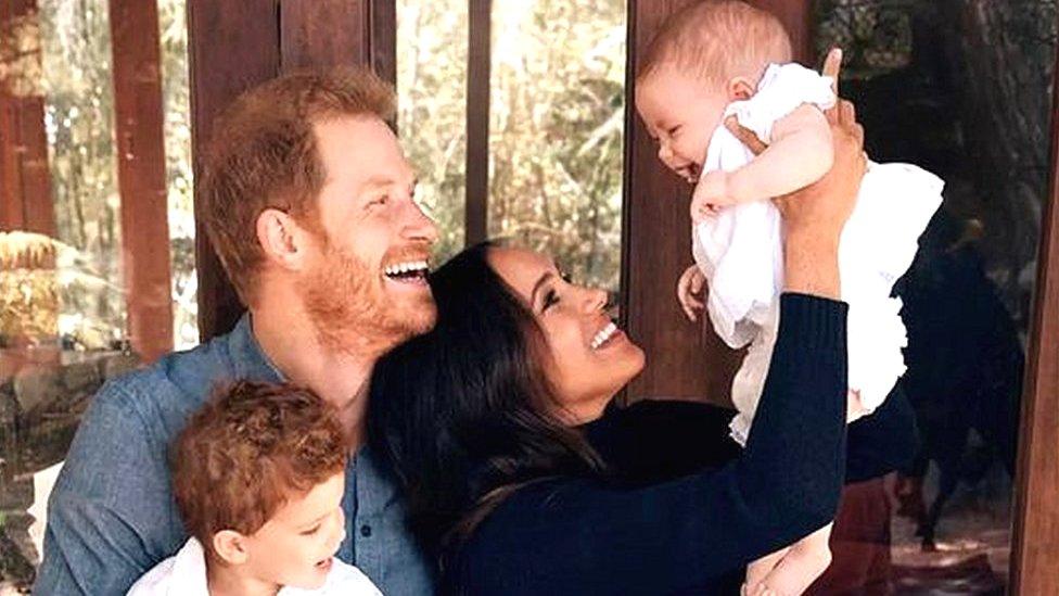 Image from 2021 holiday card from Duke and Duchess of Sussex showing the couple with their children Archie and Lilibet