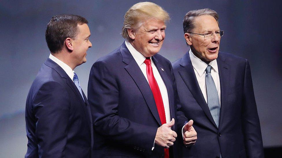 Donald Trump gives a thumbs-up with NRA leaders