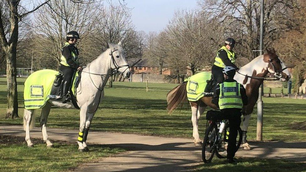 police on horses and bicycle on patrol in Cardiff