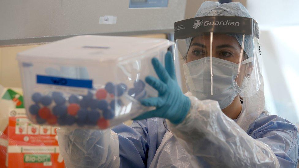 Live samples are held in a container during the opening of the new Covid-19 testing lab at Queen Elizabeth University Hospital on April 22, 2020 in Glasgow, Scotland.