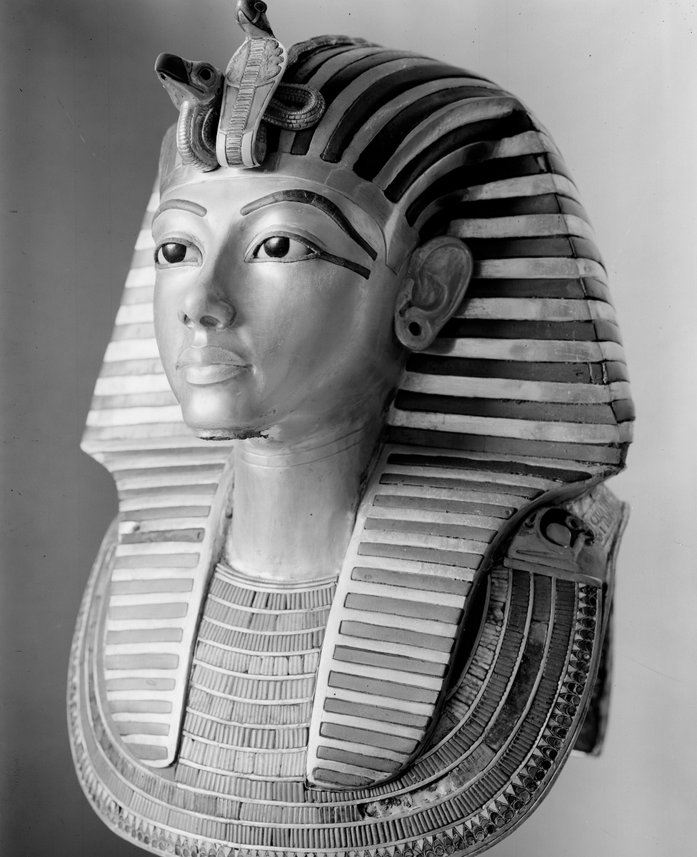 Tutankhamun's gold mask pictured on a stand during the conservation process