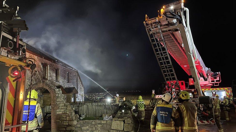 Crews at the scene of a barn fire in Trekenning