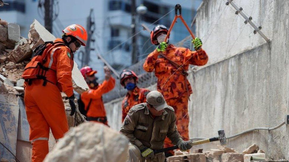 Rescuers and firefighters work at the site where a seven-story residential building collapsed in Fortaleza.