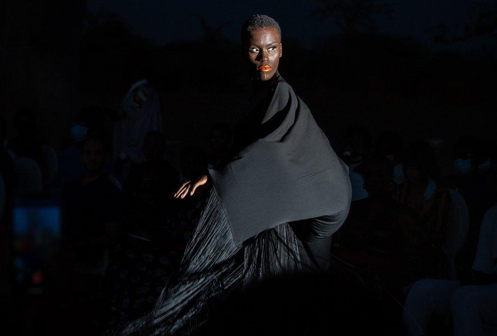 Model wearing dark clothes