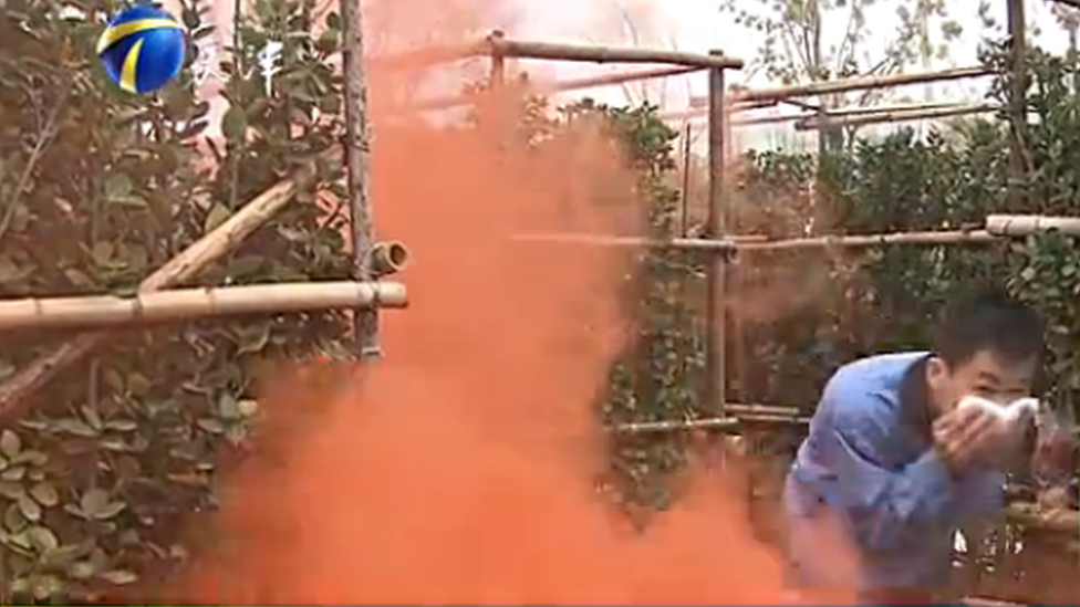 A man going through the smoke-filled maze