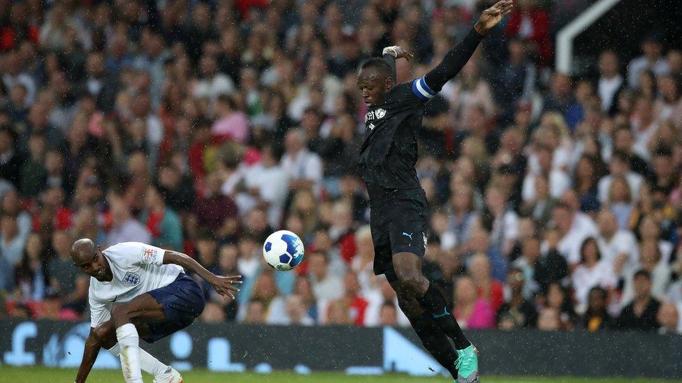 Usain Botl and Mo Farah playing football