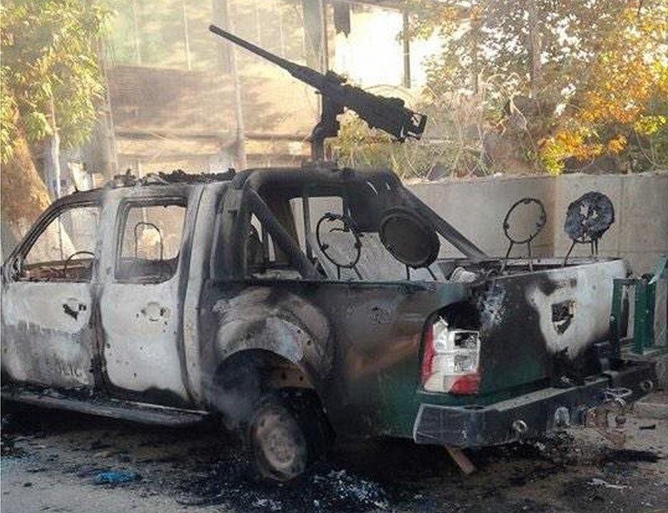 The burned-out shell of a security forces vehicle