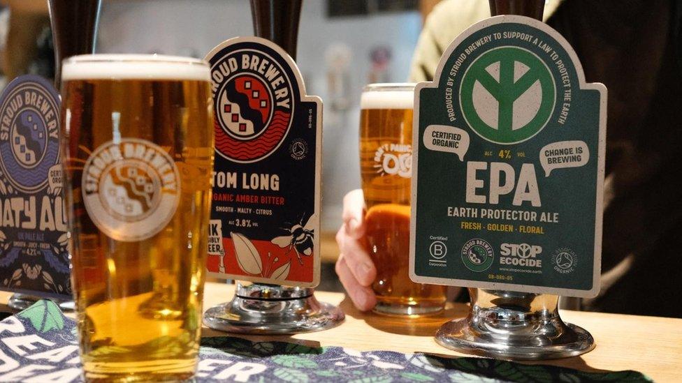 The Earth Protector Ale tap and a pint of the ale resting on a bar in Stroud