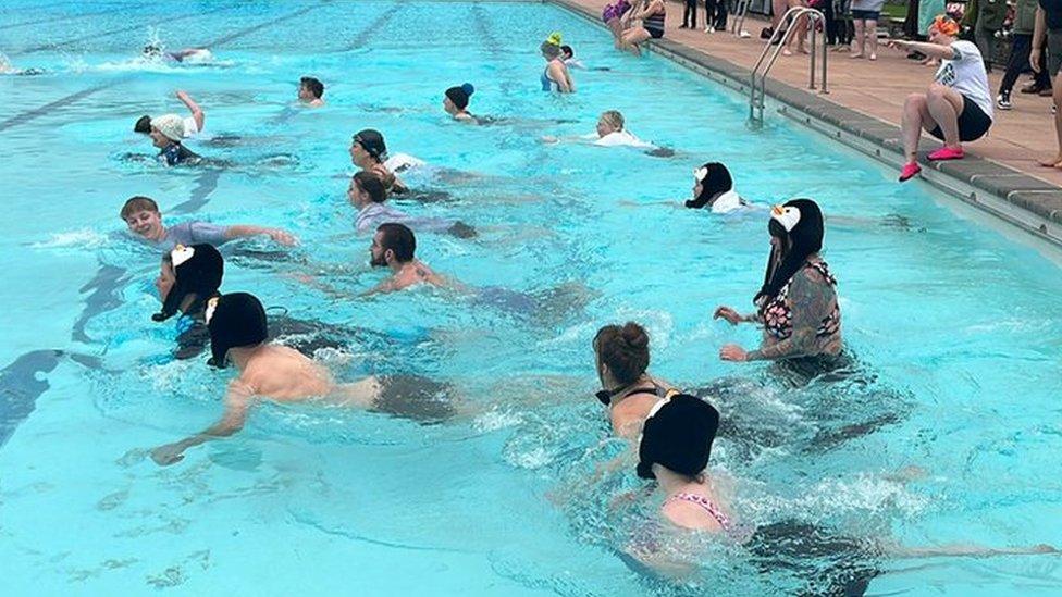 Swimmers braving the water