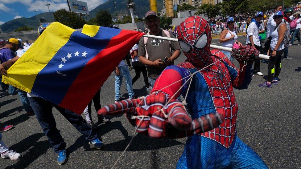 Supporters of Venezuelan opposition leader Juan Guaido take part in a rally in Caracas, on February 23, 2019