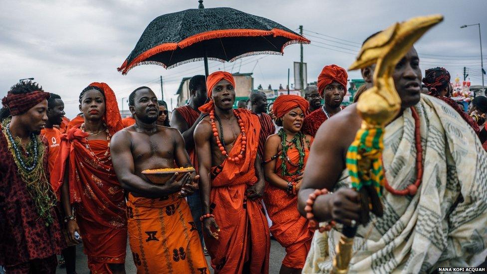 The Chale Wote Festival happens a few days after the Homowo Festival. Here, a Ga chief sprinkles kpoi kpoi, the festive meal of the Ga, in prayers for a bountiful harvest in the coming year, as part of the Chale Wote Festival.