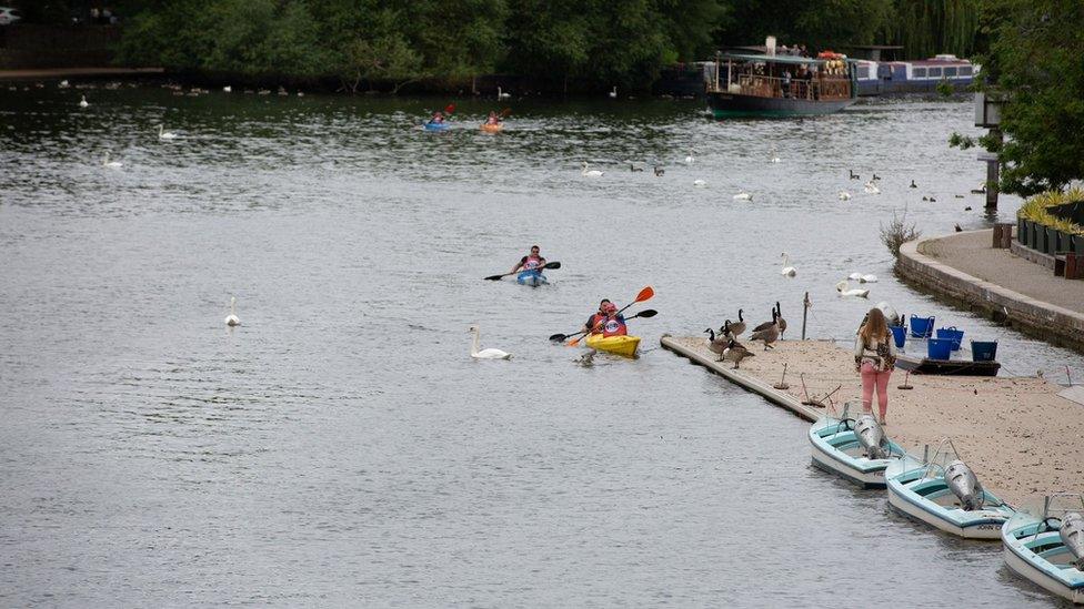 John Willis kayaking down the river