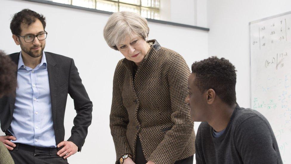 Theresa May with a pupil