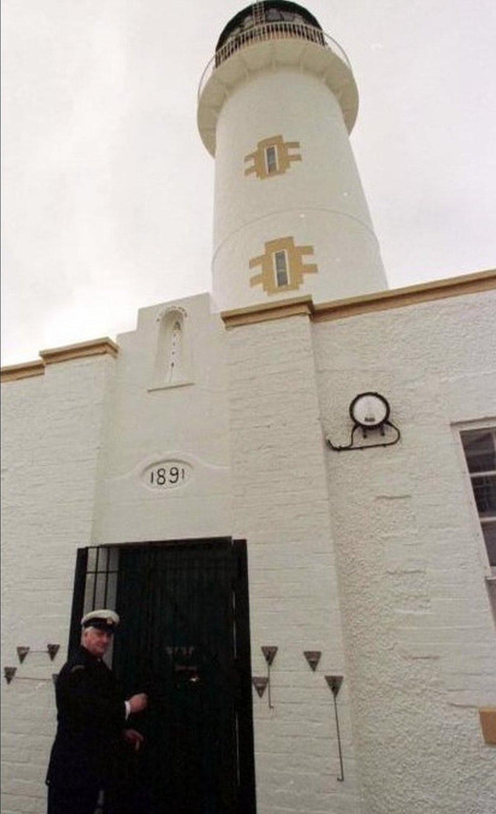 Angus Hutchison, Principal Lightkeeper locks the door of his lighthouse for the last time today (Tuesday).