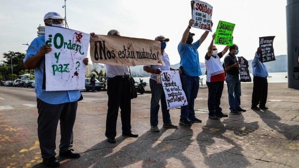 Mexican journalists hold placards during a protest demanding protection after colleagues were threatened by organized crime, in Acapulco, Mexico, 16 October 2020