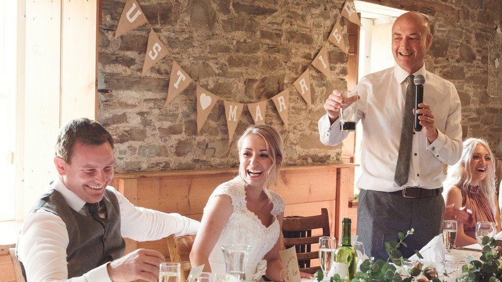 Greg making a speech at Jess' wedding