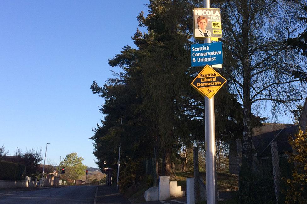 Party political signs on a lamppost in Inverness