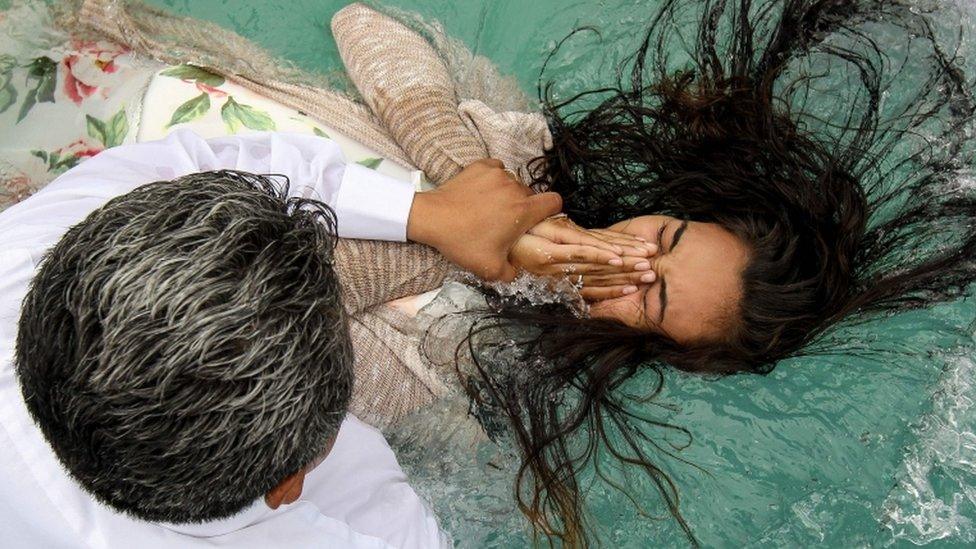 A woman is baptised in Guadalajara