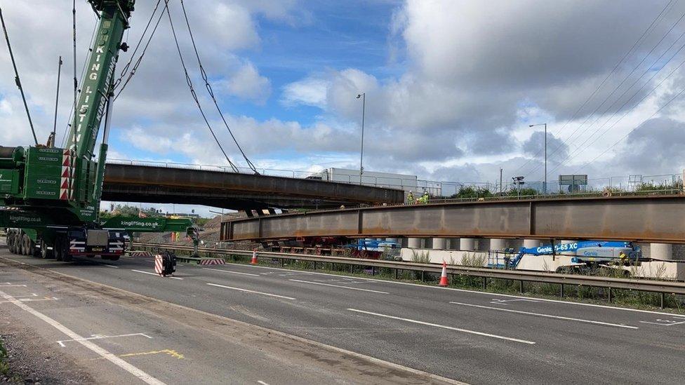 Beams being lifted into place