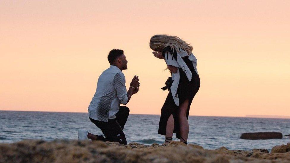 alex oxlade-chamberlain proposing to perrie edwards on a beach