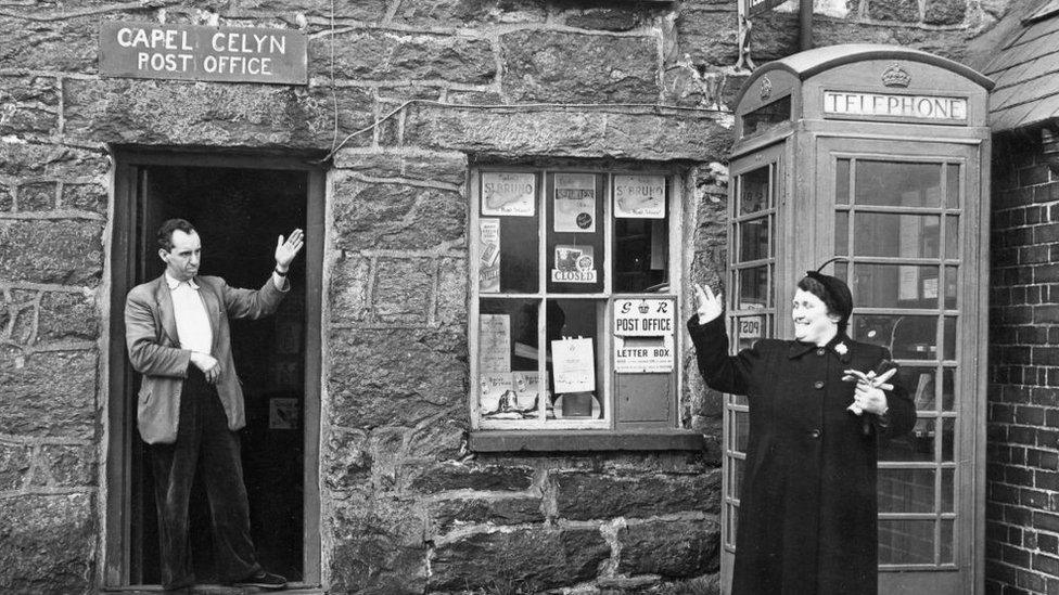 Mr Jones Parry, the postmaster, outside his post office at Capel Celyn on 10 December 1956 which was submerged when the valley was flooded