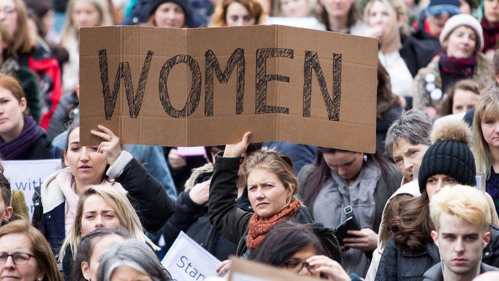 People take part in a protest in Dublin after two Ireland rugby players were acquitted