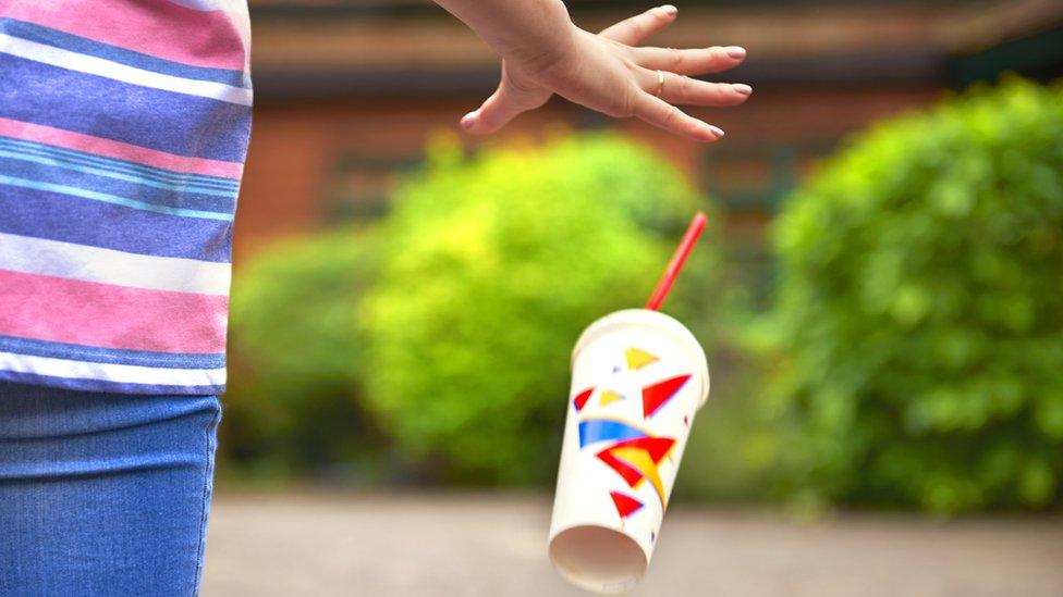 woman-throwing-litter