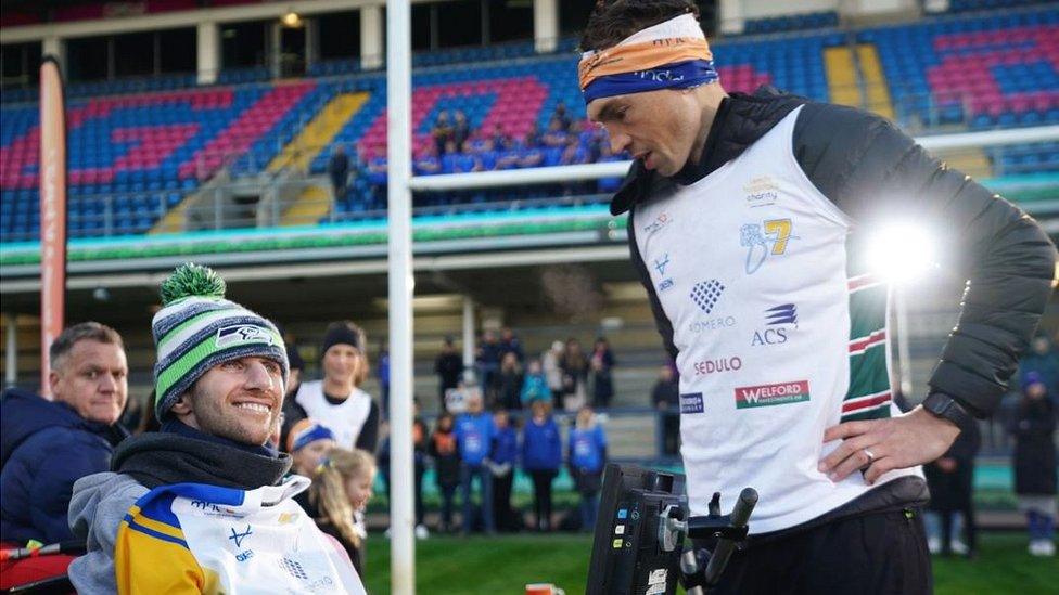 Kevin Sinfield, with Rob Burrow, at Headingley Stadium after completing the Extra Mile Challenge from Leicester to Leeds.