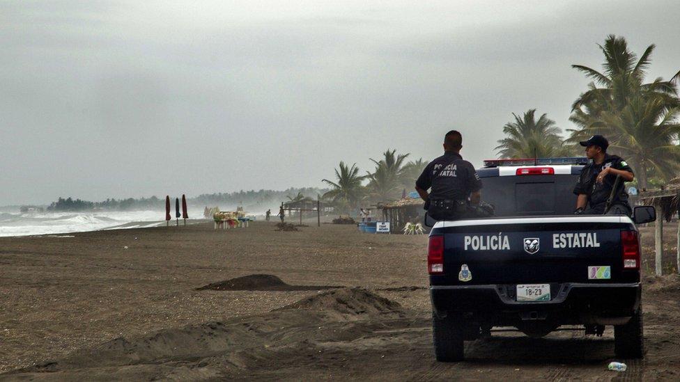 Police patrol beach in Mexico