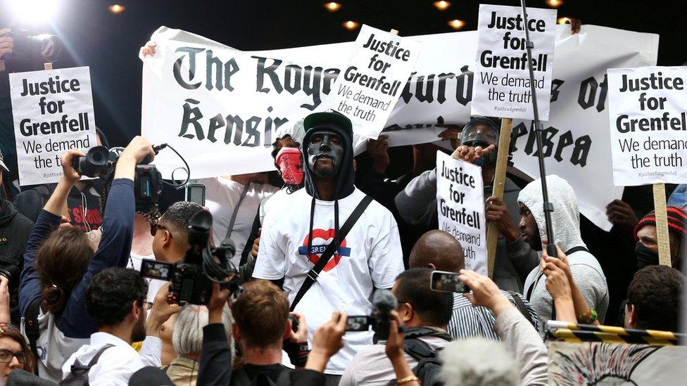 A group of demonstrators gathered outside Kensington Town Hall