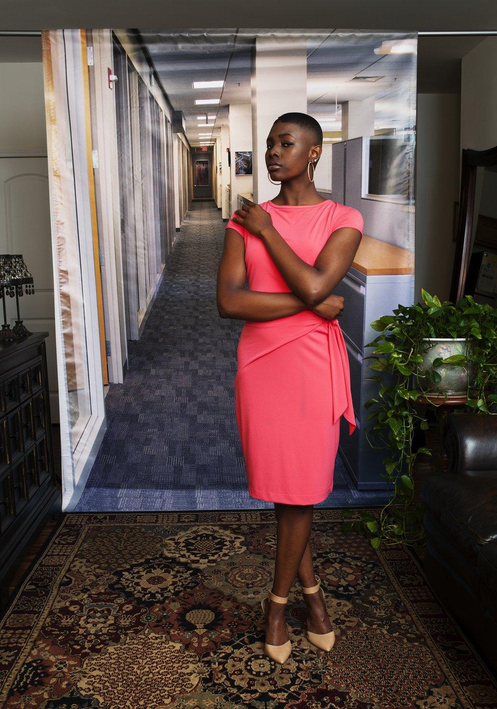 Portrait by Endia Beal showing a woman dressed for the corporate workplace