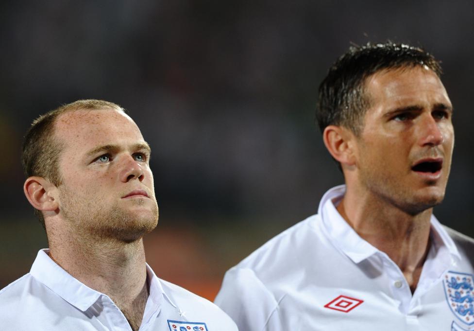 England's striker Wayne Rooney (L) and midfielder Frank Lampard during the national anthem during the 2010 World Cup