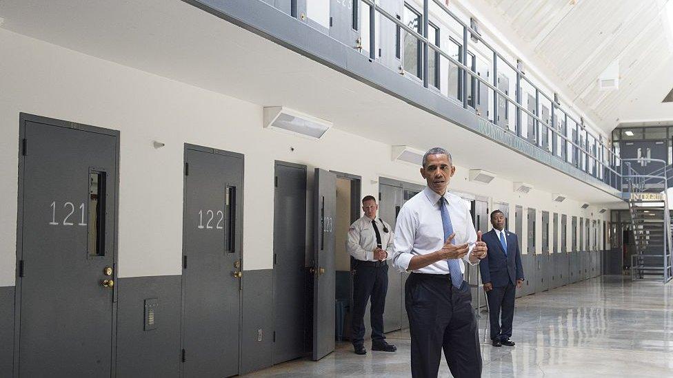 Former President Barack Obama tours a cell block at the El Reno Federal Correctional Institution in El Reno, Oklahoma.