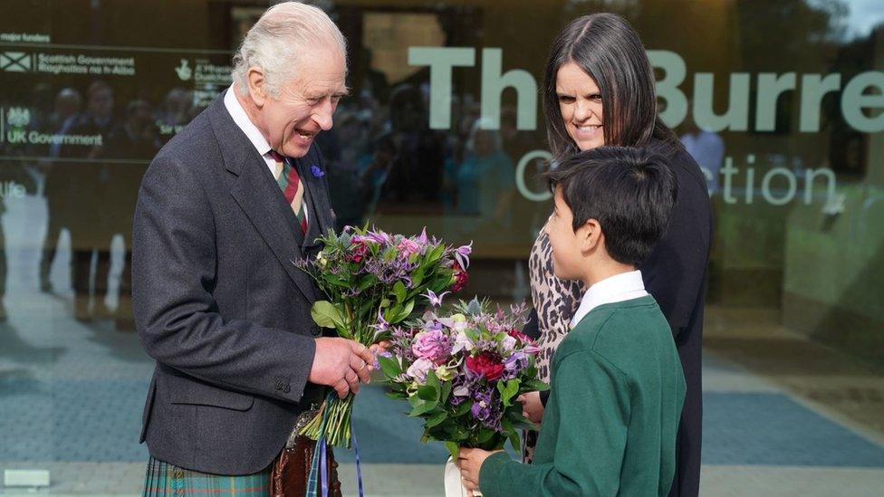 King Charles was presented with flowers by local school children