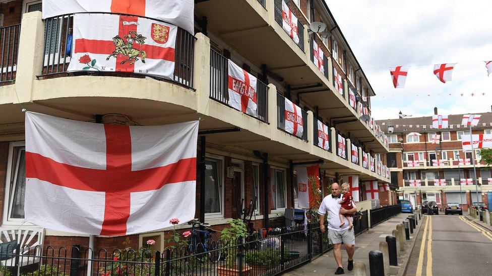 Housing estate covered in England flags