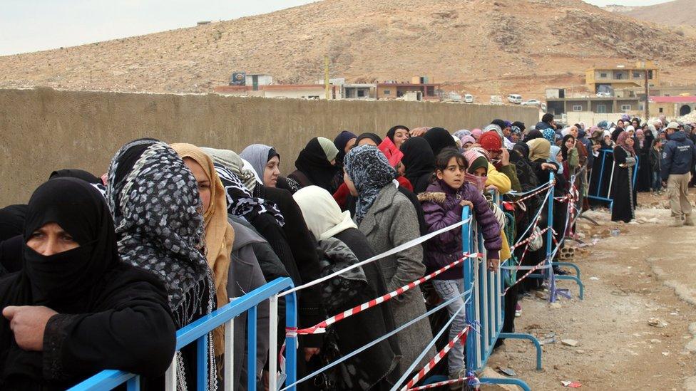 Syrian refugees wait to register upon their arrival in the strategic Lebanese border district town of Arsal on November 18, 2013, after fleeing the fighting in the neighbouring Syria.