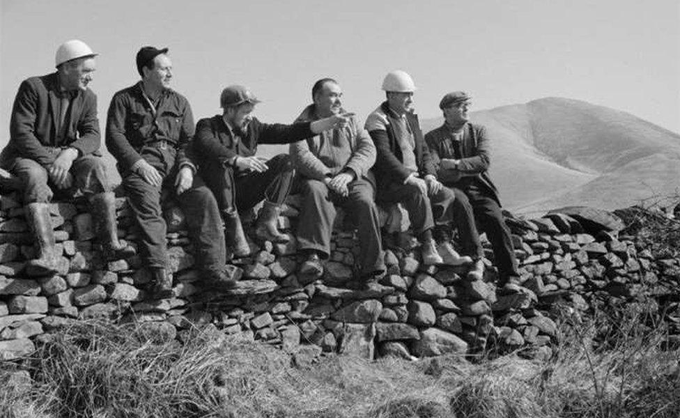 Workmen sitting on a wall who were building part of the M6 Motorway between Killington and Tebay, in Cumbria. Photo from March 1968