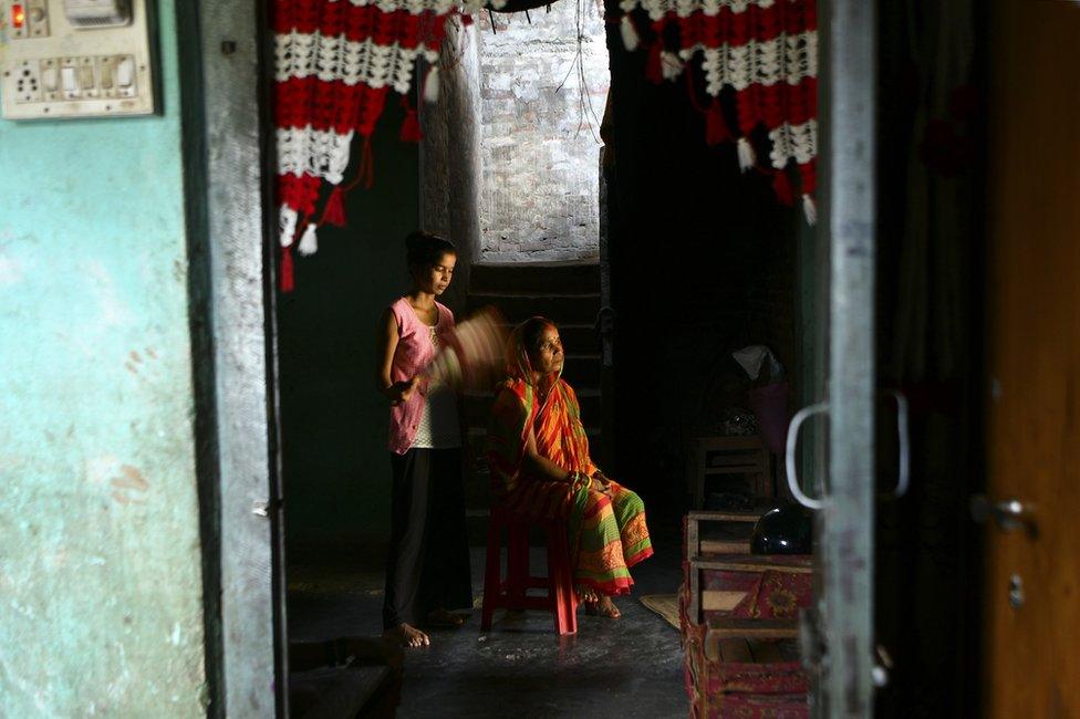 Anjali Patel with her mother indoors